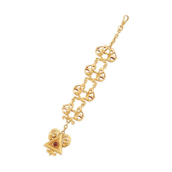 Antique 14k yellow gold and ruby watch fob chain showing scrolled openwork links, terminal, and swivel clasp
