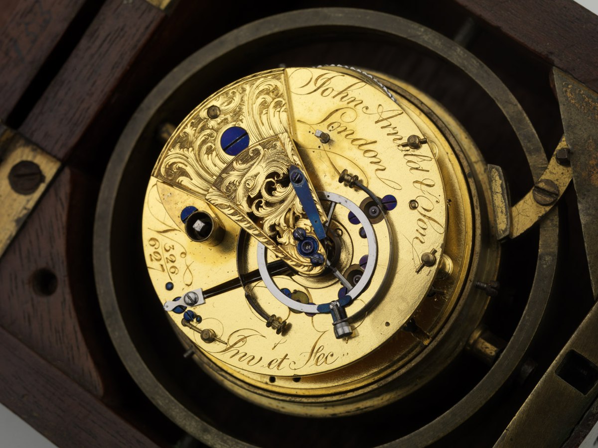 Top view of the gilt brass fusee movement and Arnold balance inside its gimballed brass bowl