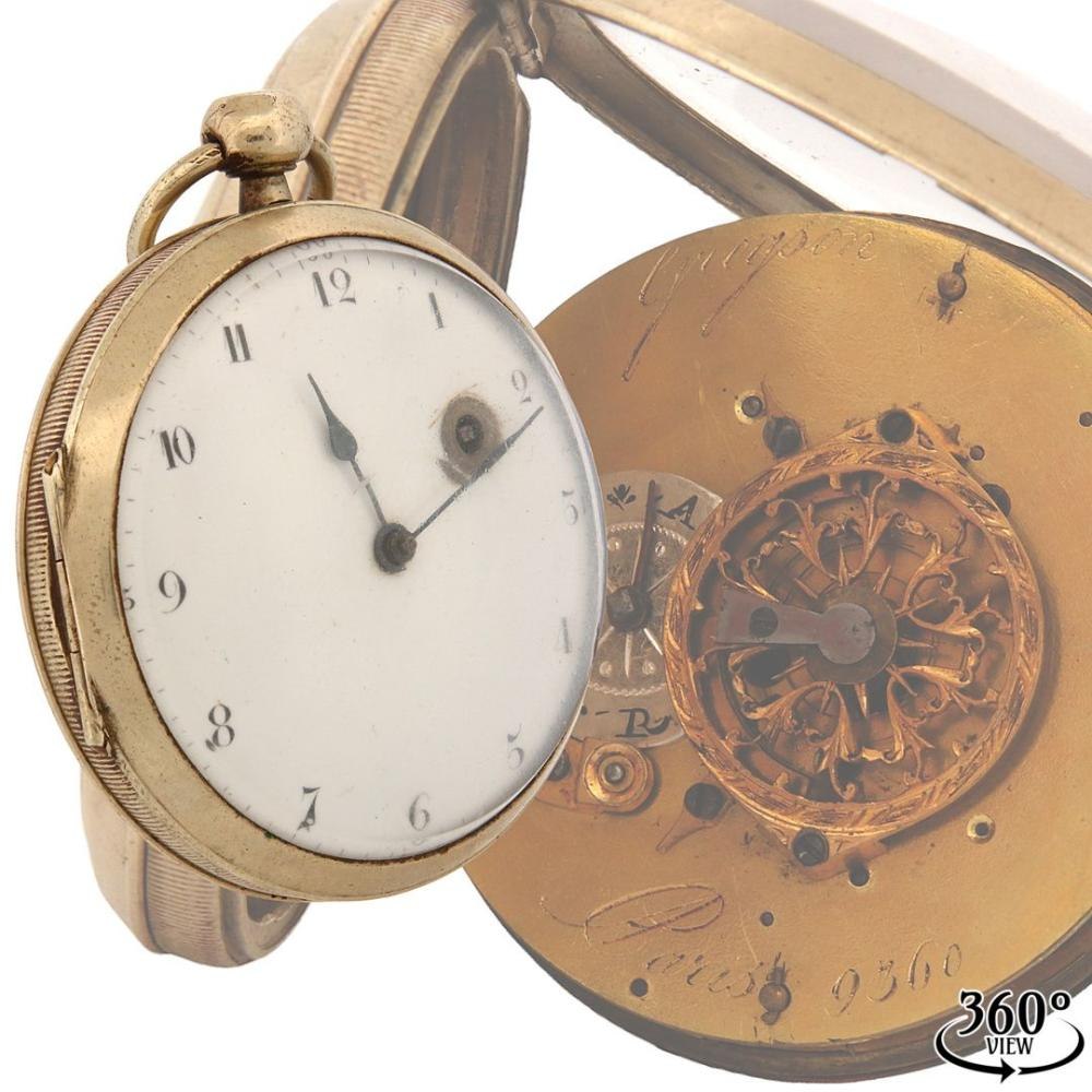 A Gregson Paris pocket watch showing the enamelled dial and the ornate, openwork verge balance cock of the movement.