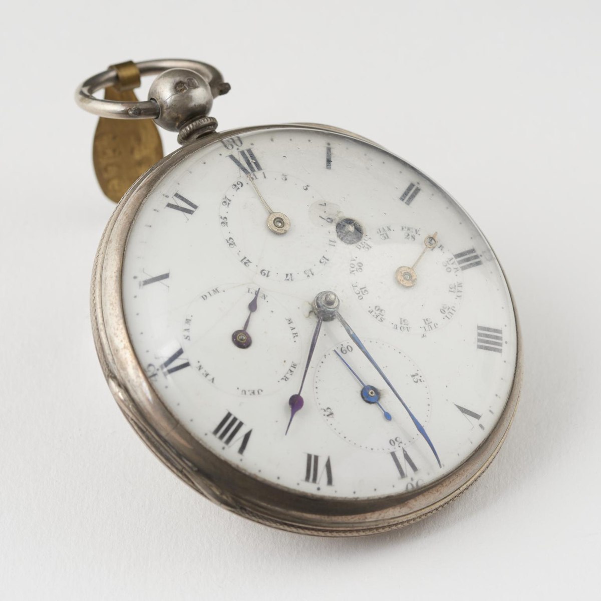 Oblique dial view of the silver calendar pocket watch (object 1916-213).