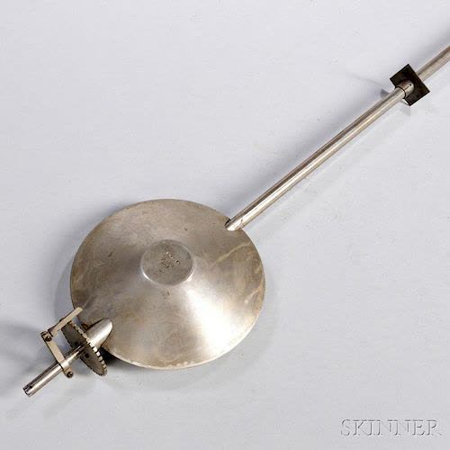 Lower portion of Riefler invar pendulum showing lenticular bob, rating nut, and rod assembly