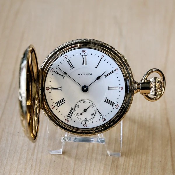 Dial and open front hunter case of the Waltham pocket watch