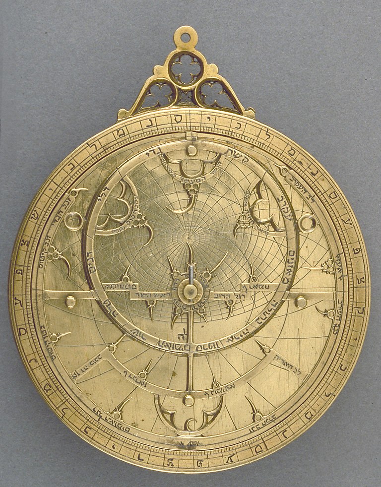 Front view of the gilt brass astrolabe showing the rete, throne, and circular scales.