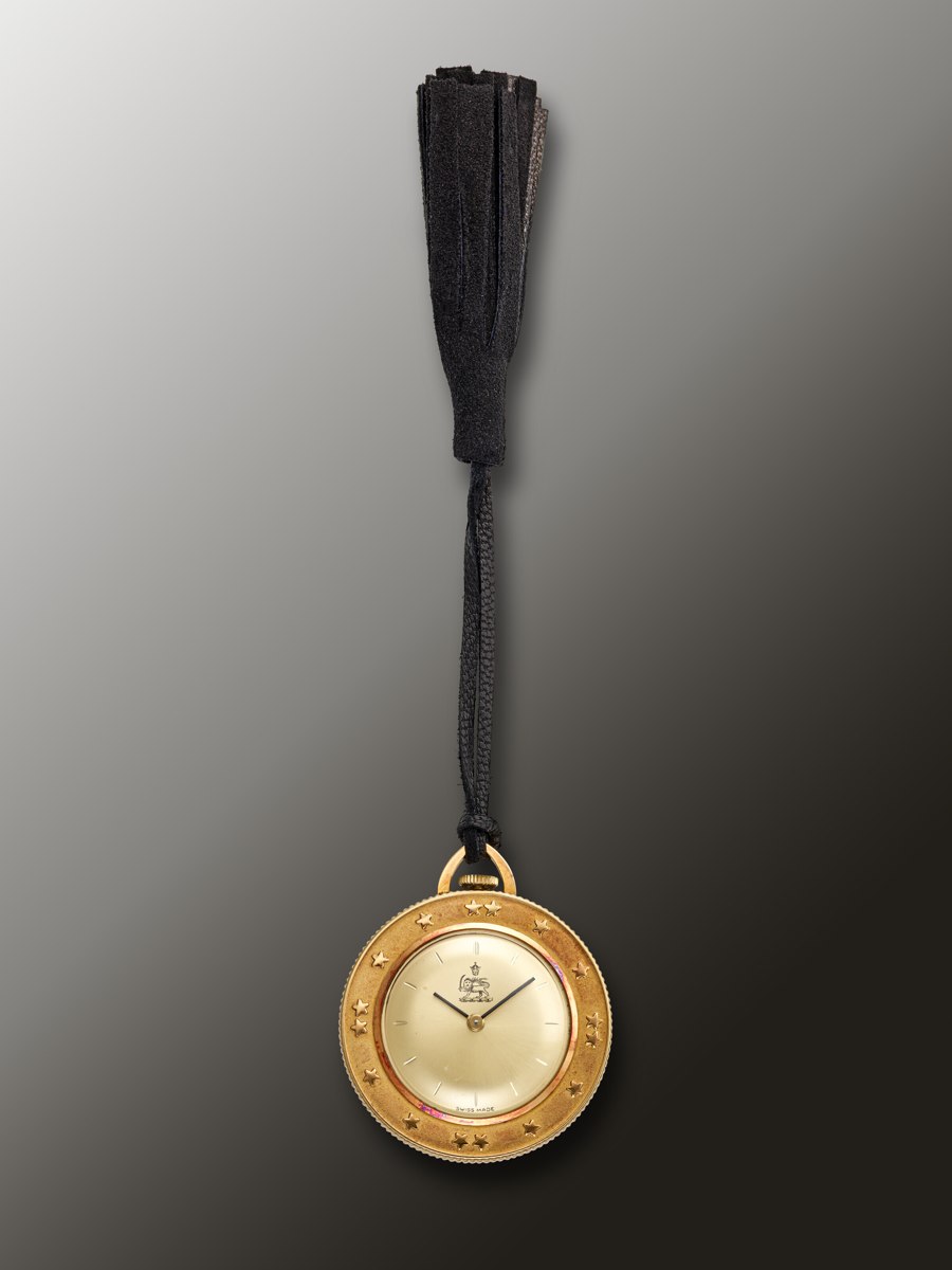 Front view of the Sarcar openface medallion pocket watch showing the champagne dial and tassel suspension cord