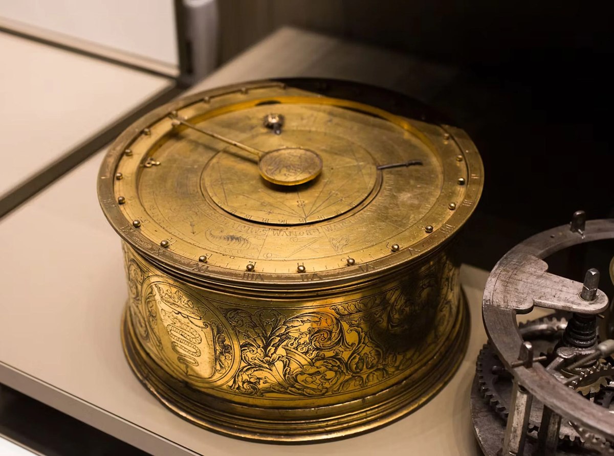 Oblique view of the 1525 Jacob Zech astronomical table clock showing the engraved cylindrical case and astronomical dial