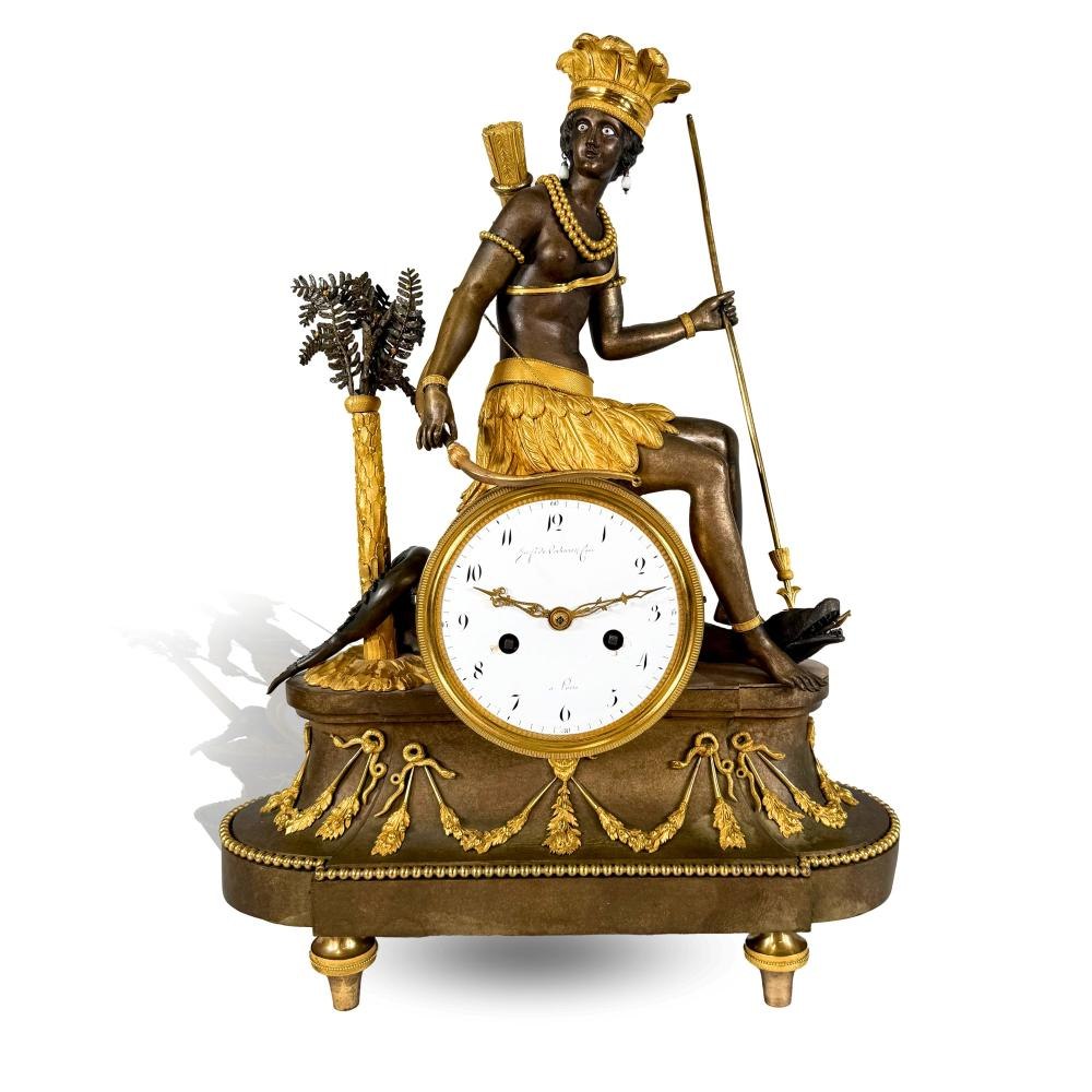 The "Aux Amériques" figurative clock by Jean-Simon Deverberie, featuring a central Native American figure and enamel dial, seen from the front.