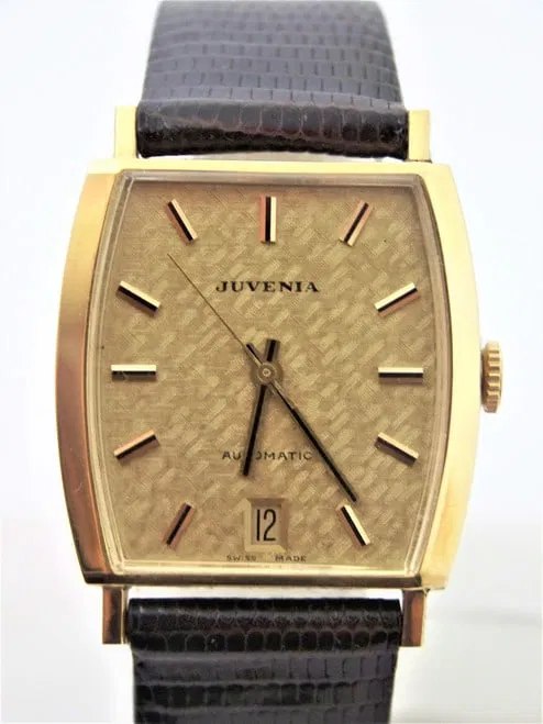 Front view of Juvenia automatic wristwatch with textured gold dial and date aperture