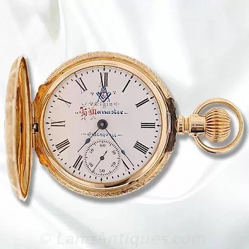 Front view of open Elgin hunter case pocket watch showing dial with custom Masonic insignia and subsidiary seconds