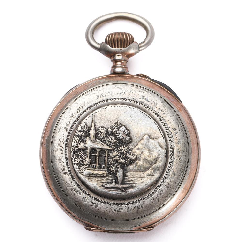 Exterior relief-engraved cover of the silver hunter case pocket watch