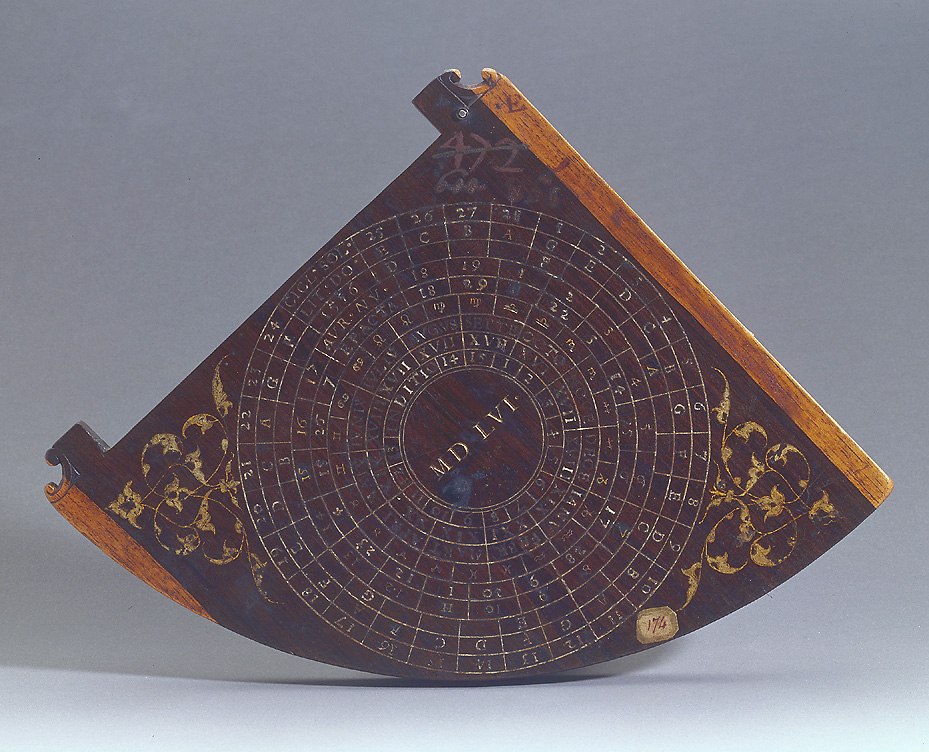 Rear face of the ebony quadrant, showing the concentric circular calendar diagram and decorative foliate elements.
