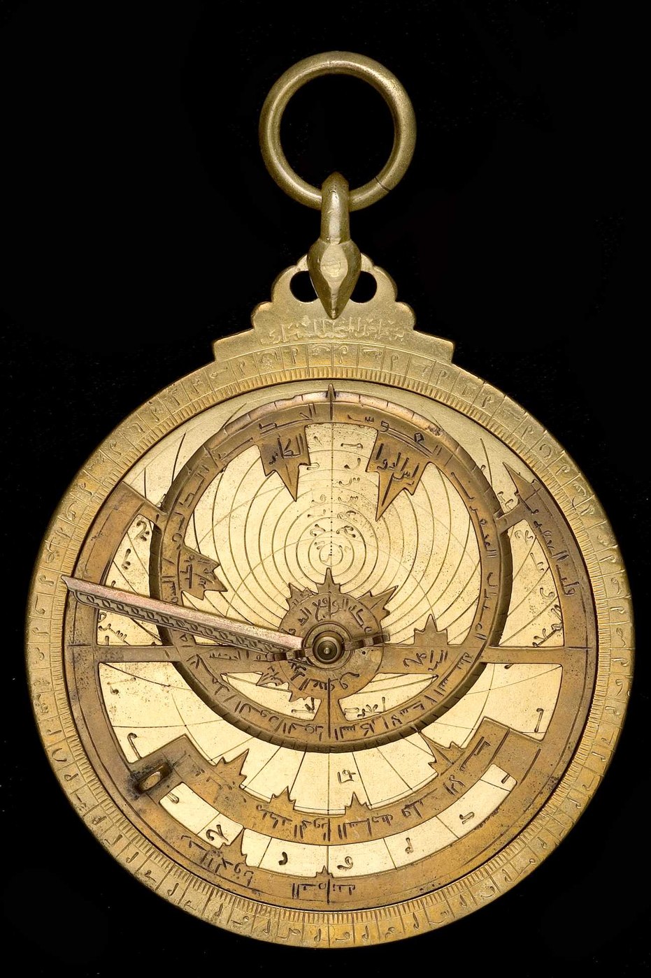 Front view of the brass astrolabe (inventory 47632) showing the rete, pin and wedge, and the five-lobed throne.