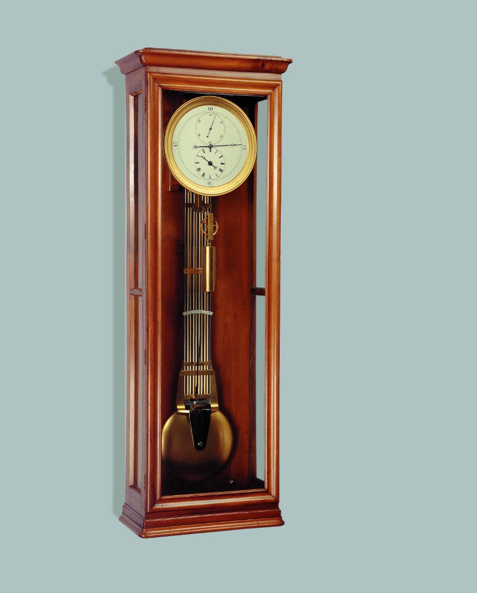 The solid walnut case is decorated with rounded mouldings and glazed on three sides (MIH IV-492)