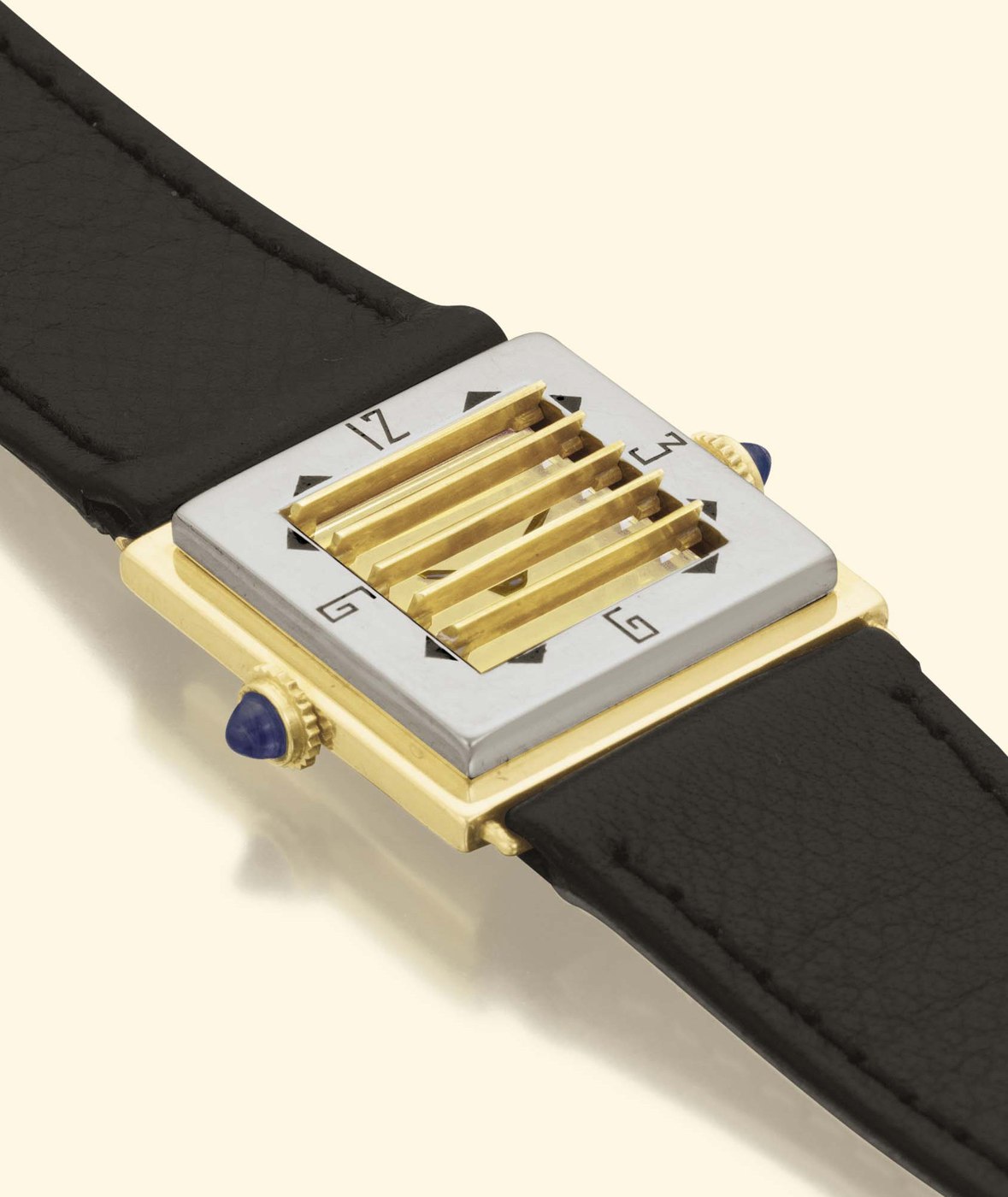 Front view of the Vacheron & Constantin montre à volets with gold shutters partially obscuring the dial, showing the 3 o'clock winding crown and the 9 o'clock crown for the shutter mechanism.