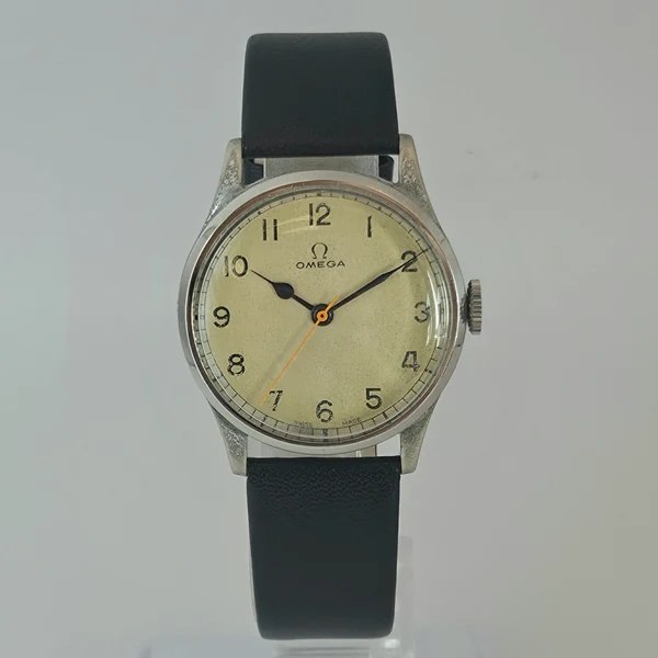 Front view of the 33mm Omega manual-winding wristwatch showing cream dial, Arabic numerals, and orange seconds hand