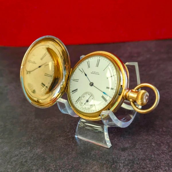 Front view of Waltham hunting case pocket watch with open front lid