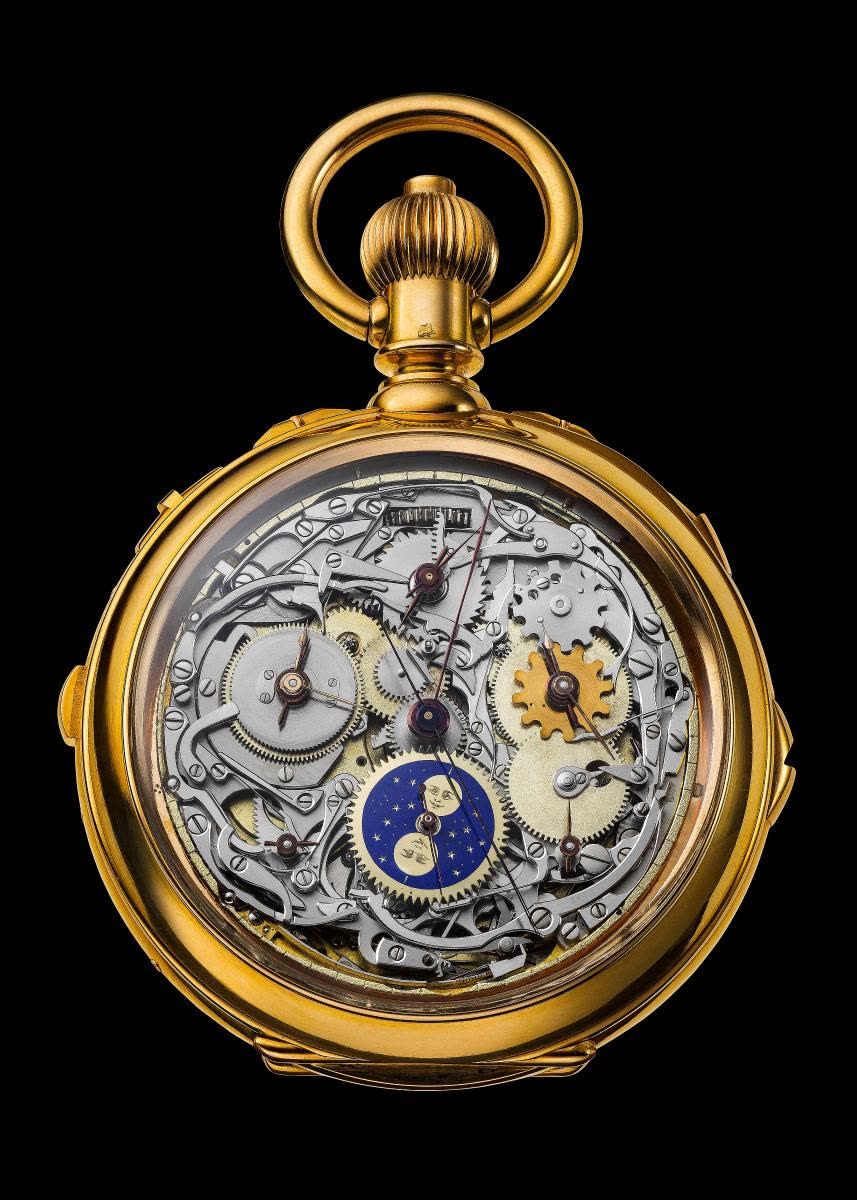 The polished gold case has several pushpieces and slides for operating a number of specific functions (MIH I-501)