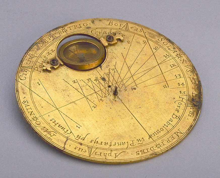 A gilt brass horizontal dial with a pivoted compass and pin gnomon, attributed to Carlo Plato, 1585.