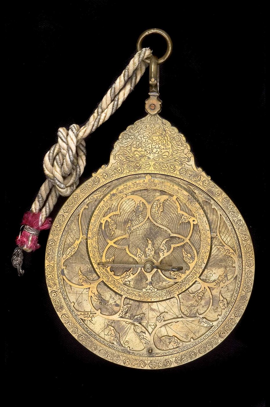Astrolabe by 'Abd al-A'imma (1719/20) with foliate rete and engraved throne.