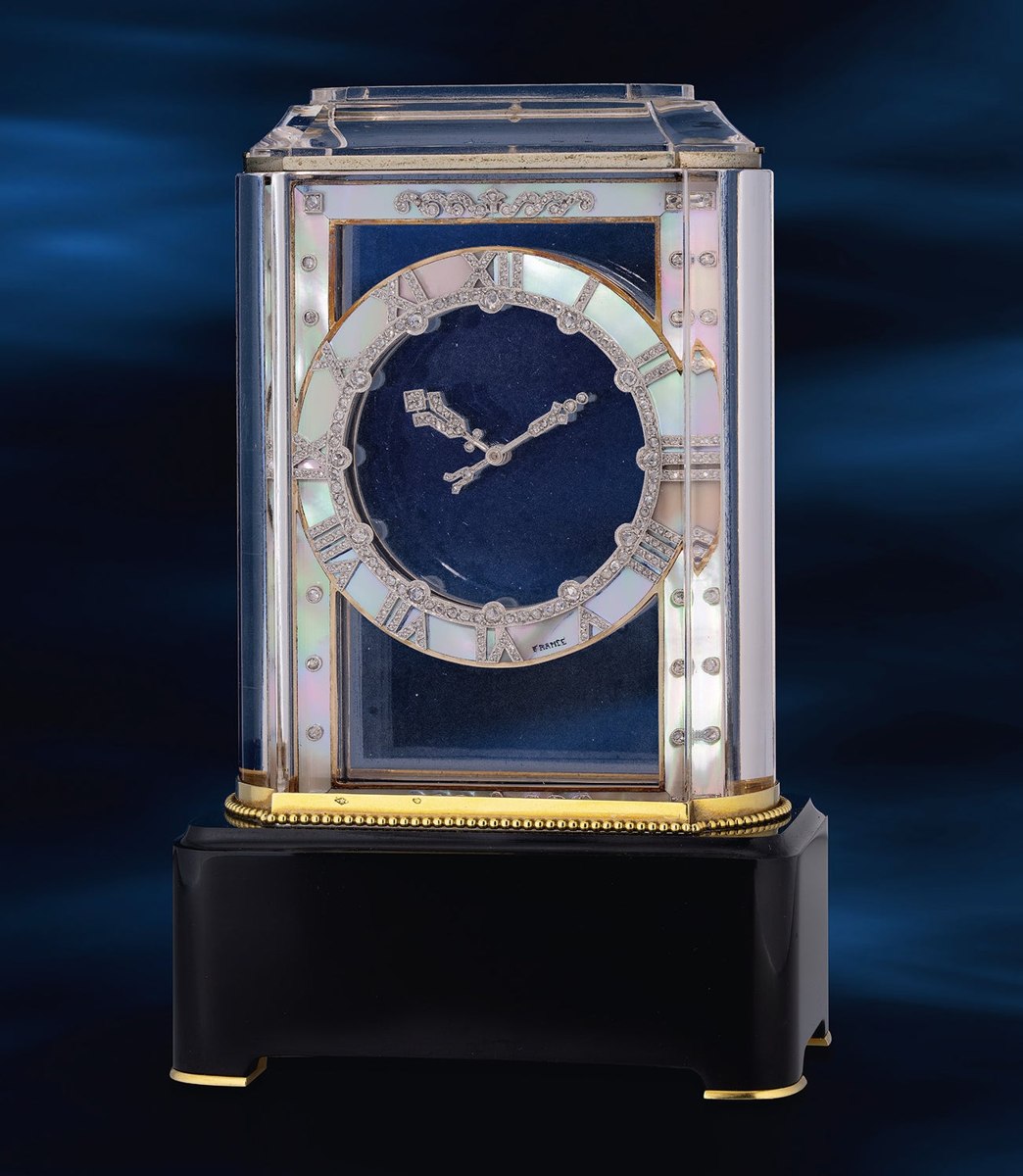 Front view of the Cartier Modèle A rock crystal, mother-of-pearl, and onyx mystery clock