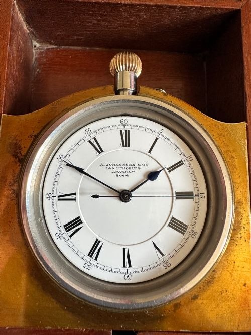 Dial view of the Johannsen & Co Admiralty Pattern chronometer deck watch in fitted brass plate