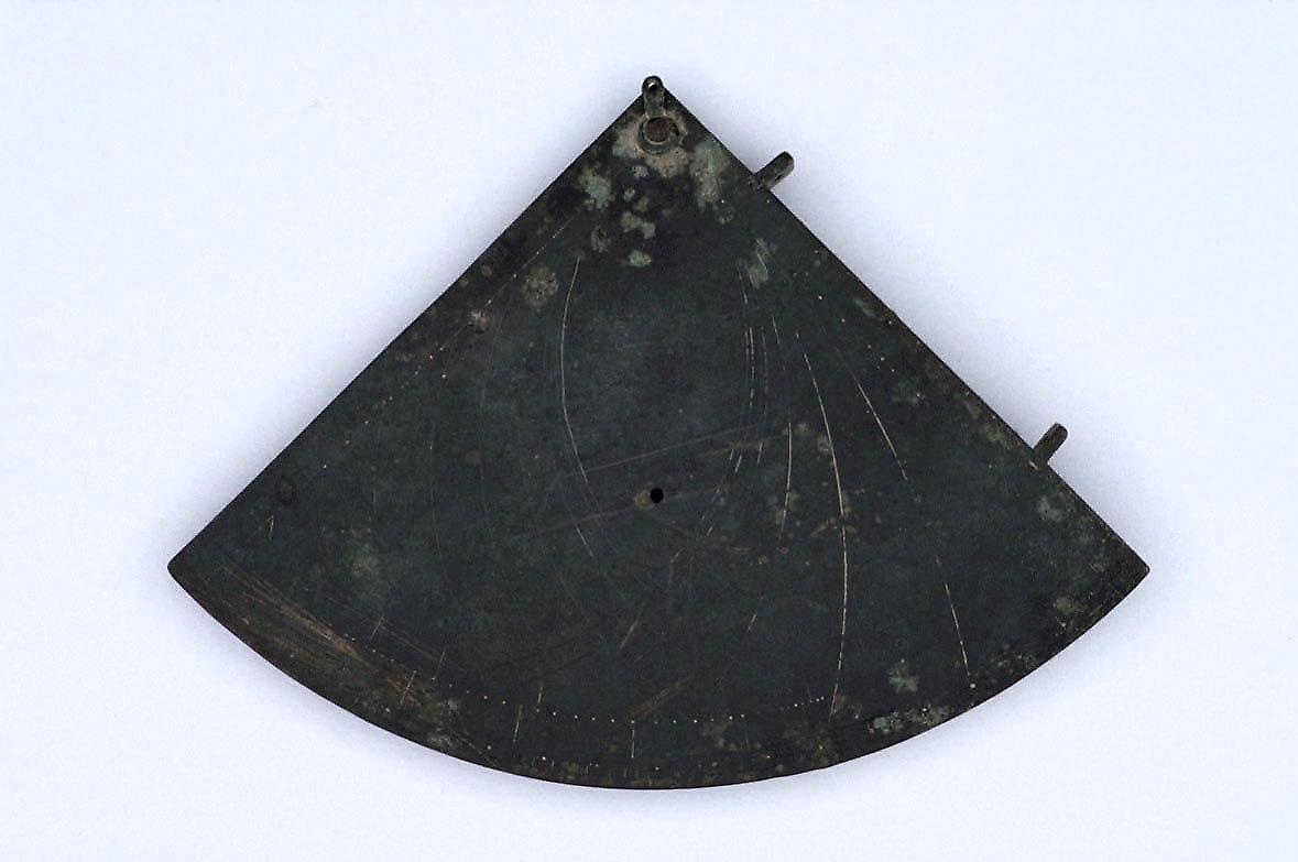 The obverse of the unsigned copper quadrant, showing the sketched hour lines, central hole, and the sighting holes along the edges.