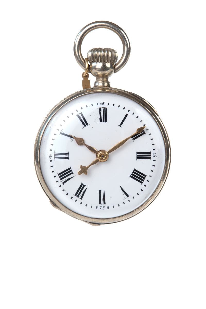 The bezel of the very heavy nickel silver case may be opened to set the hands manually (MIH I-375)