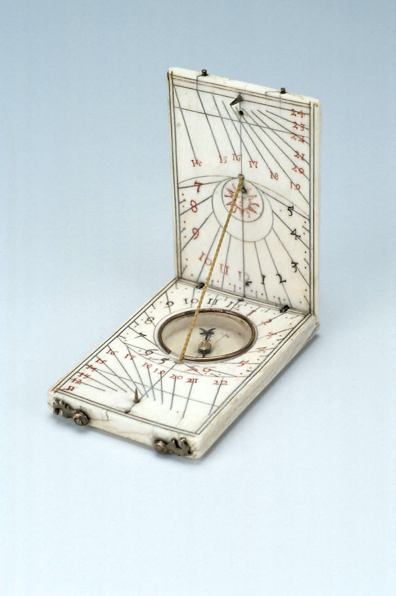 Diptych dial, Nuremberg, circa 1600, showing the interior dial faces and inset compass.