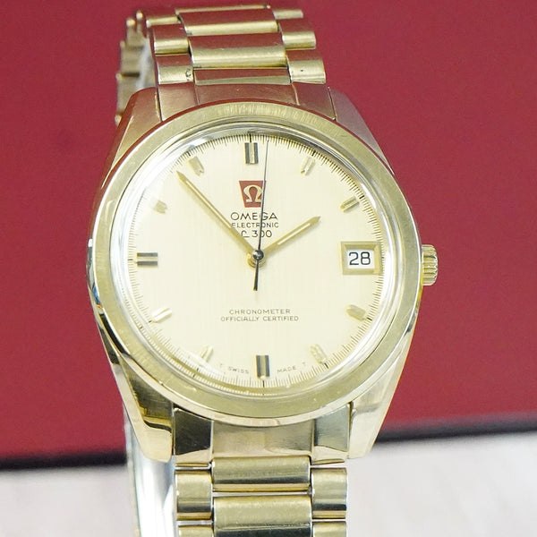 Front view of the Omega Electronic f300Hz wristwatch showing champagne dial and bracelet
