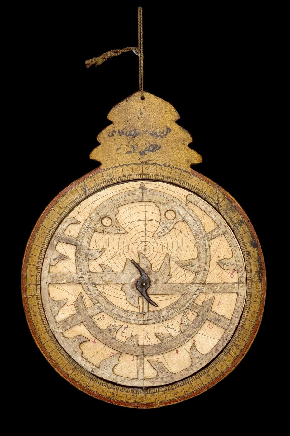 Front view of the wooden astrolabe (inventory number 47792) showing the rete, throne, and limb.