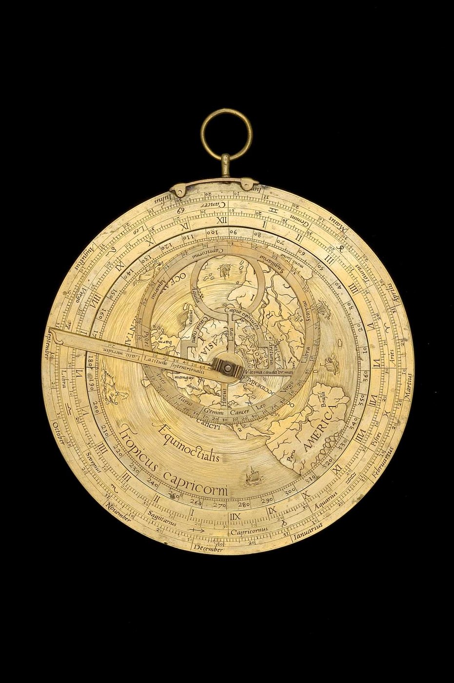 Front view of the geographic astrolabe showing the rete, the broad limb with scales, and the geographic plate projection.