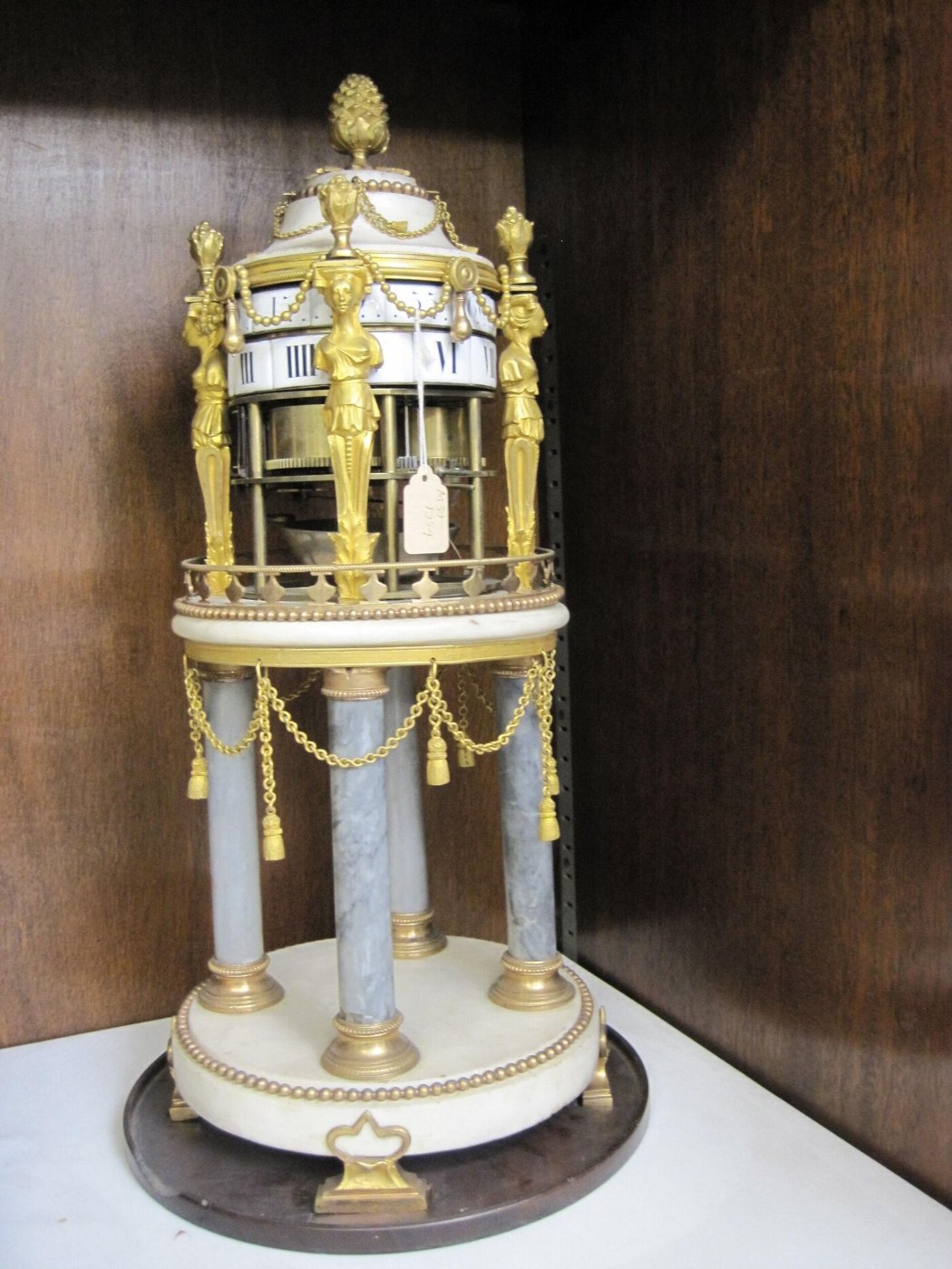 Temple clock by Barancourt, Paris, showing the rotating dial drums and ormolu female term supports.