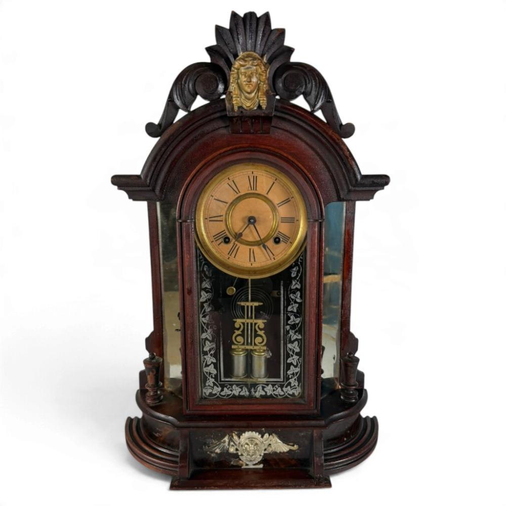 Front view of Ansonia Triumph mirror-side mantel clock in walnut case