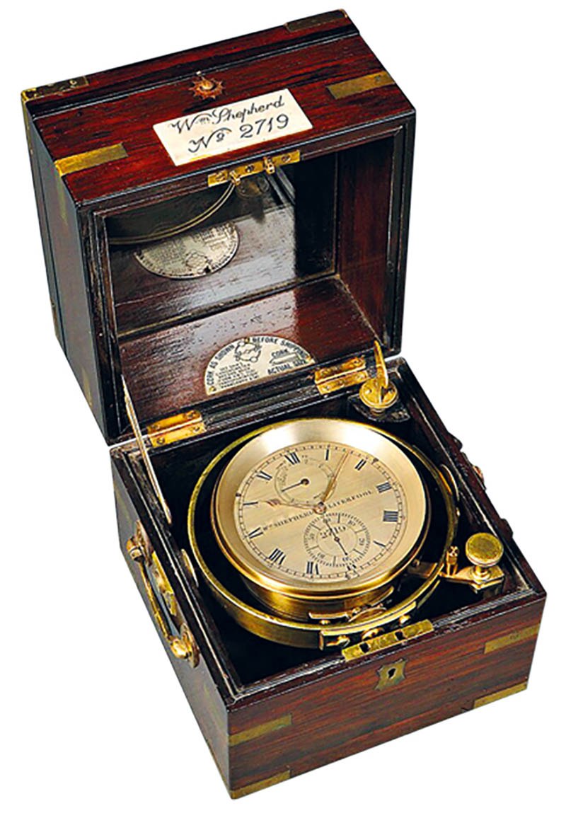 Three-quarter view of the W.M. Shepherd marine chronometer mounted in its gimbaled rosewood box