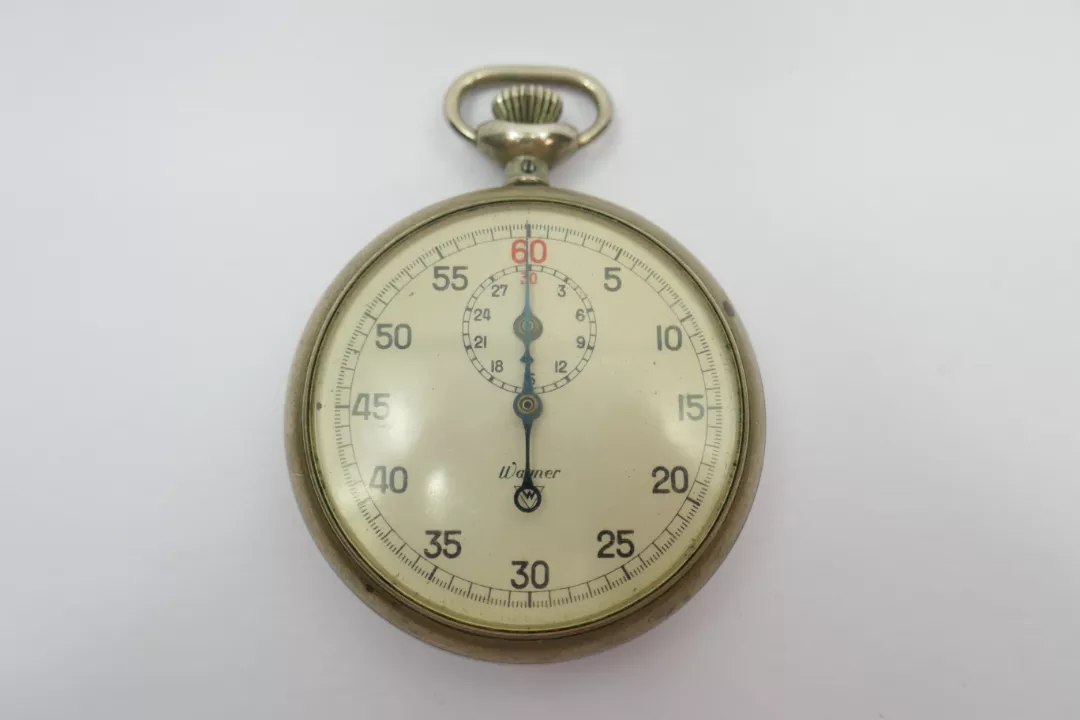 Dial view of the Wagner pocket stopwatch showing blued hand, outer track, and upper subsidiary register