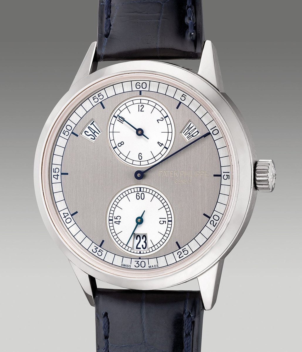 Dial and case front of the Patek Philippe Ref. 5235G-001 regulator wristwatch on strap