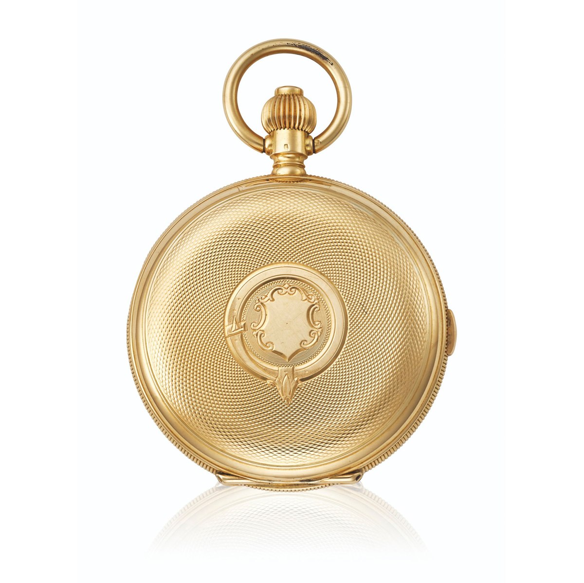 Front view of the closed yellow gold hunter case with engine-turning and vacant central cartouche