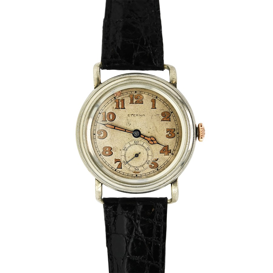 Front view of the Eterna trench watch showing the nickel case, rotating bezel with pointer, dial, and crown