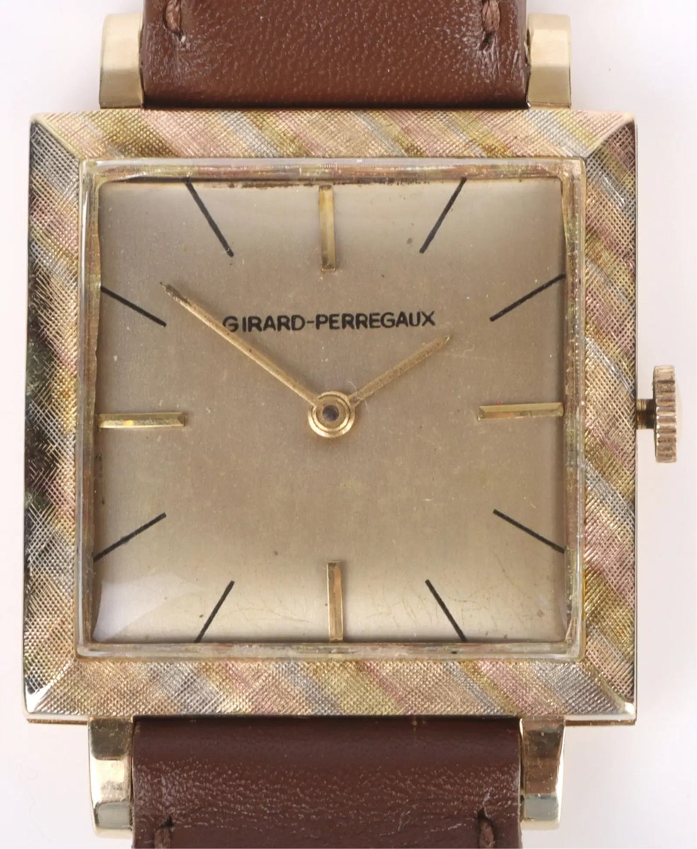 Dial and square textured case of the Girard-Perregaux 14k gold wristwatch