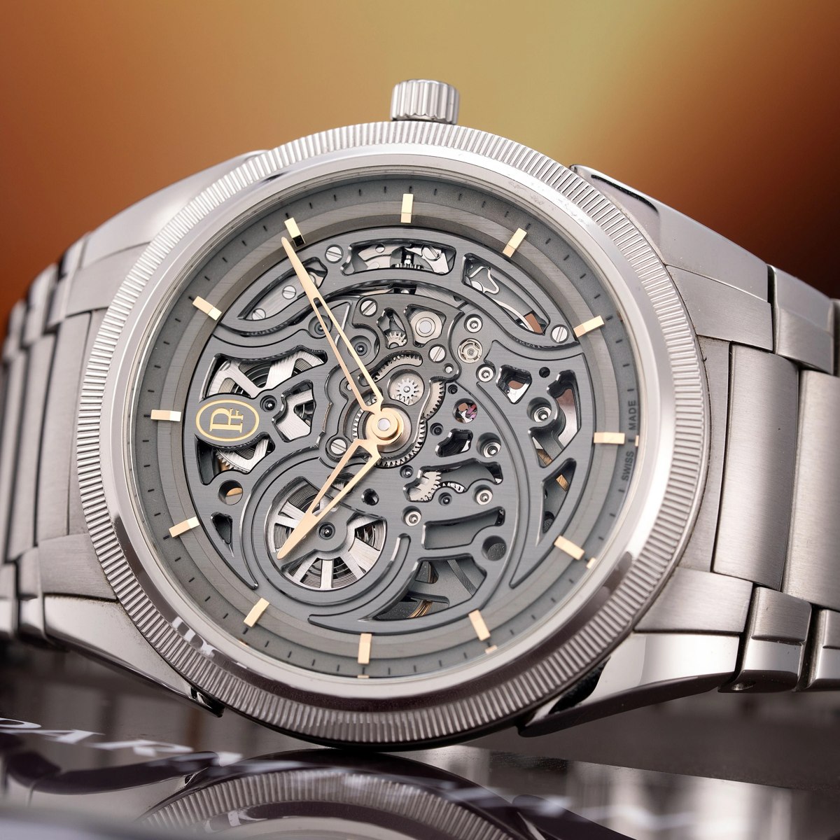 Oblique front view of the Parmigiani Fleurier Tonda PF Skeleton showing the openwork dial, knurled bezel, and integrated bracelet