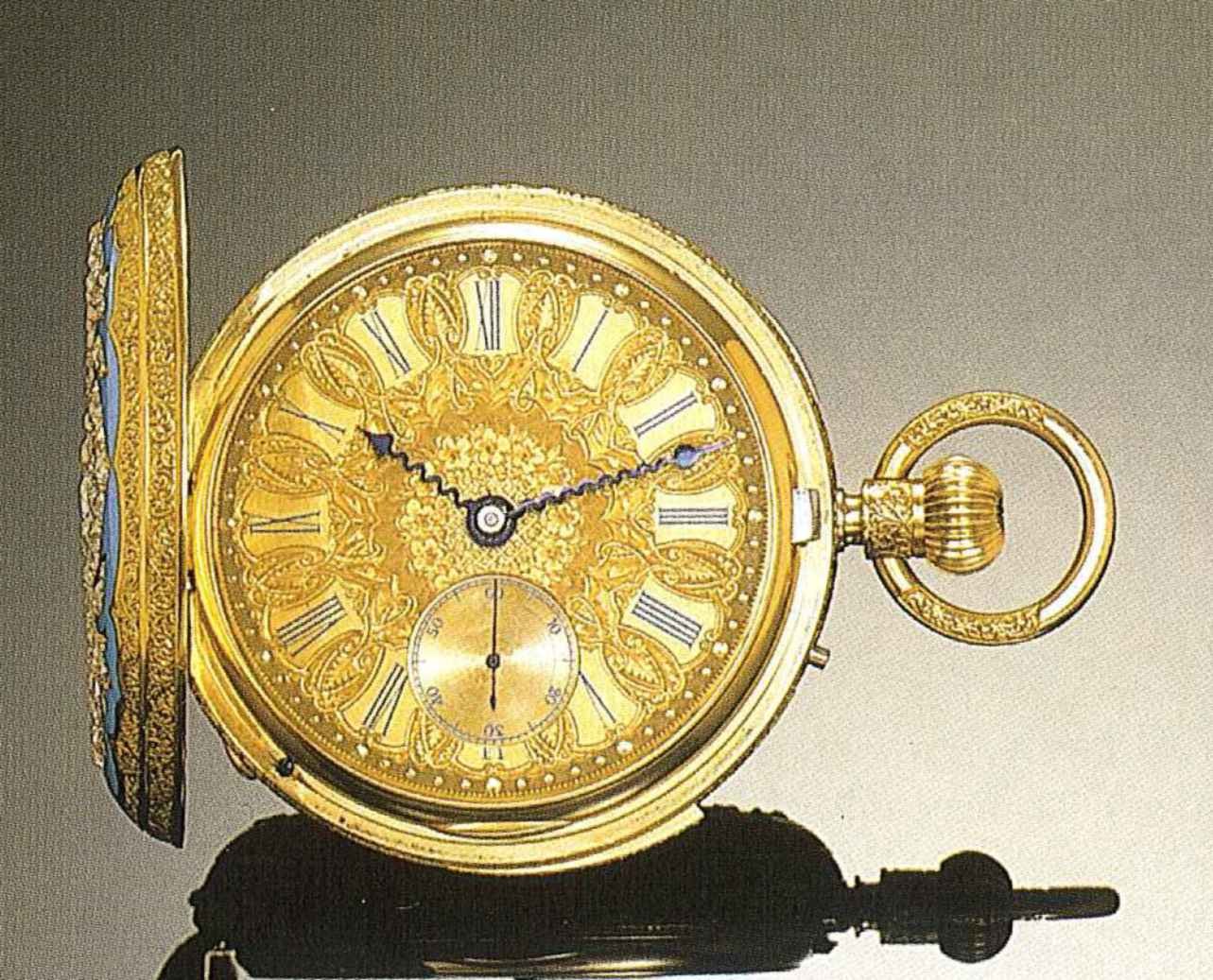 Front view of the gold hunting-cased watch showing the engraved dial, turquoise enamel cover, and chased decoration on the pendant and bow.