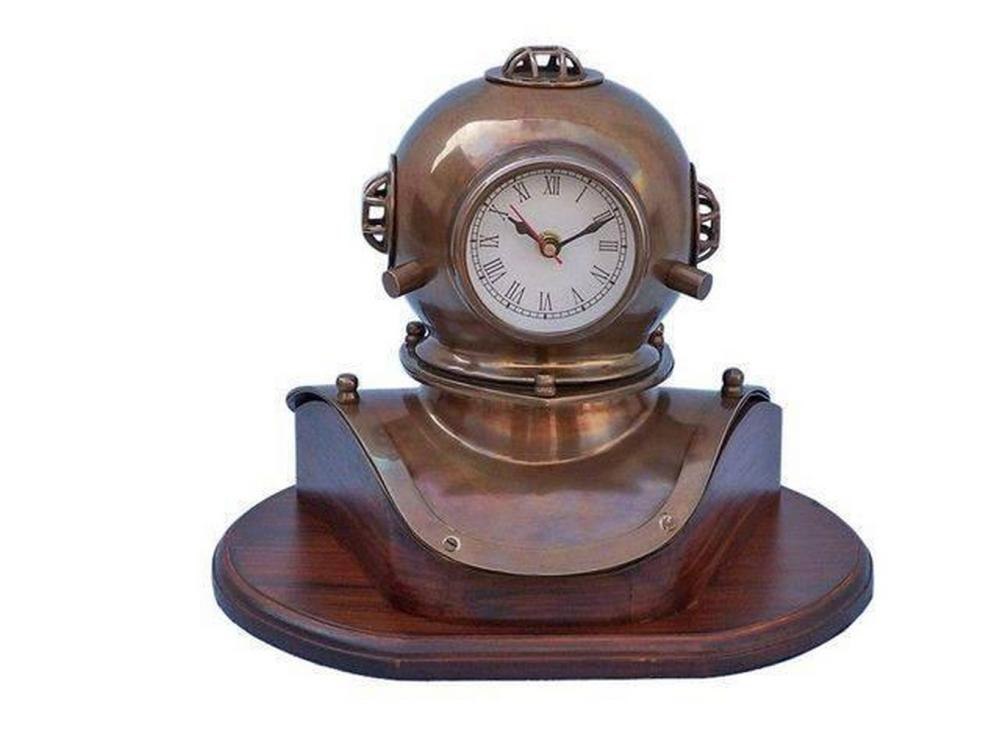 Front view of the brass diver's helmet clock mounted on a rosewood base, showing the dial and overall proportions.