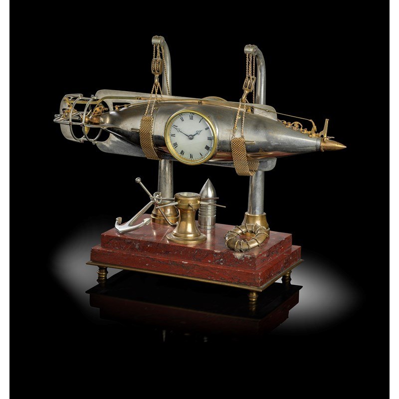 French torpedo industrial automaton timepiece on rosso antico marble base, late 19th or early 20th century