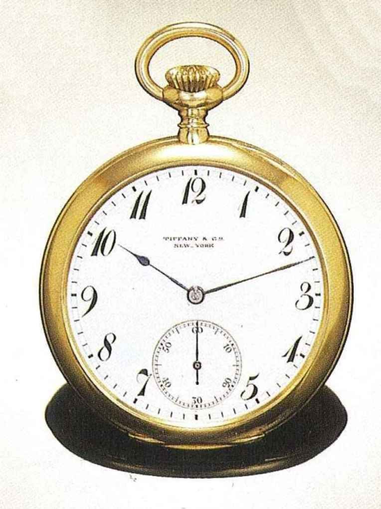 Front view of the 18-karat gold pocket watch showing the white enamel dial with Breguet numerals and Tiffany & Co. signature.