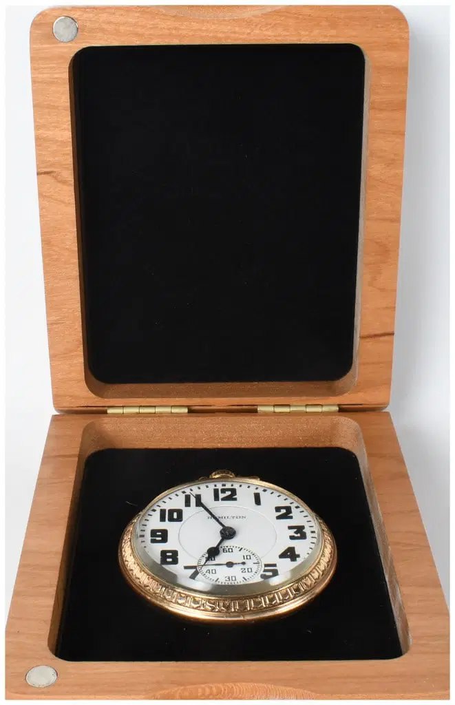 Front view of Hamilton Model 992 pocket watch dial and engraved bezel seated inside its custom presentation box