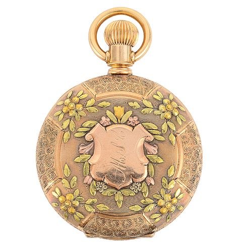 Exterior view of the E. Howard & Co. 14K tri-color gold hunter pocket watch case with floral engraving and central monogram
