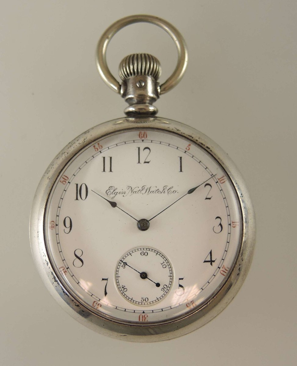 Dial and front view of the Elgin open-face pocket watch