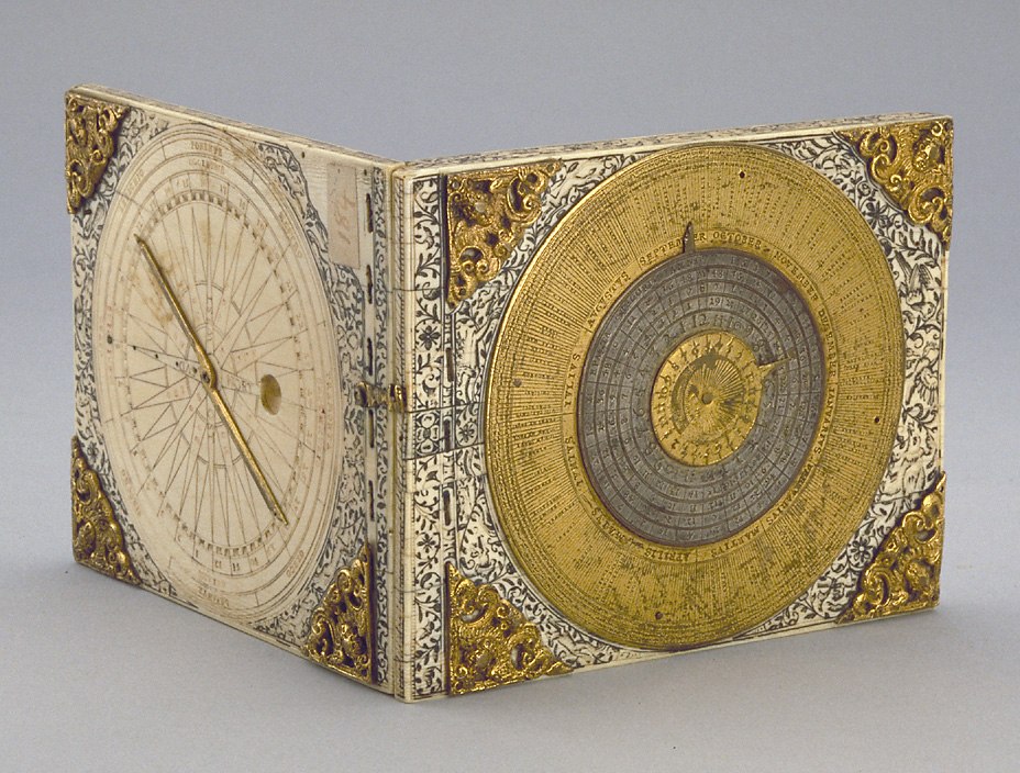 The diptych dial in an open position showing the internal clockwork features and the exterior volvelle calendar mechanism.
