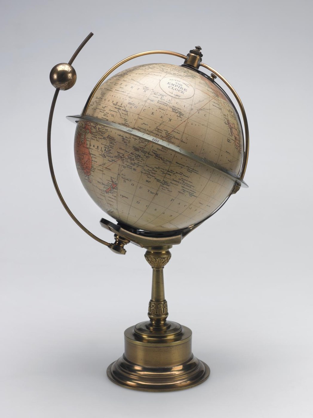 The Empire type world clock, showing the terrestrial globe, the equatorial ring, and the attached solar indicator arm.