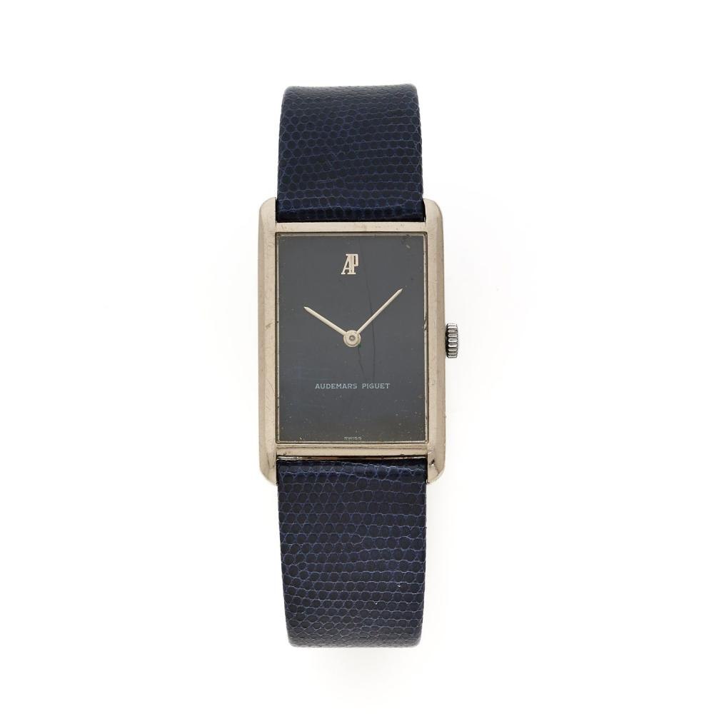 Frontal view of the Audemars Piguet manual winding wristwatch with its matte black dial and 18k white gold rectangular case.