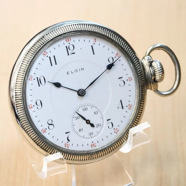 Three-quarter front view of the Elgin Grade 241 pocket watch on a display stand